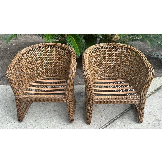 A pair of good looking all weather woven wicker barrel back occasional chairs. Double wall construction. Well made. These...