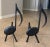 Pair of Mid-Century black cast iron music note motif fireplace andirons by Tennessee Chrome Plate of Nashville.