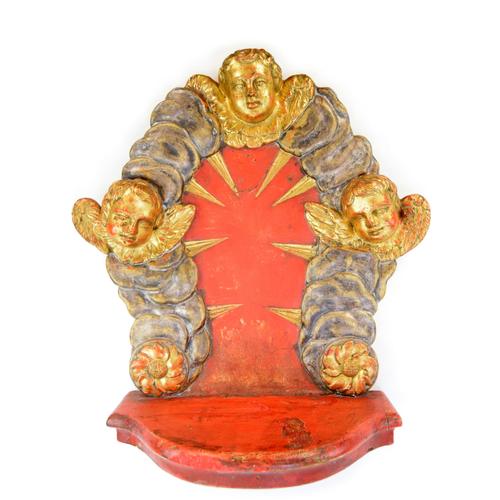An exquisite wooden Neo-Baroque home altar, highlighted by three gilded angels, meticulously crafted and arranged in...