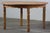 This vintage oak table captures the essence of Henning Kjærnulf's design philosophy, blending a bold brutalist aesthetic...