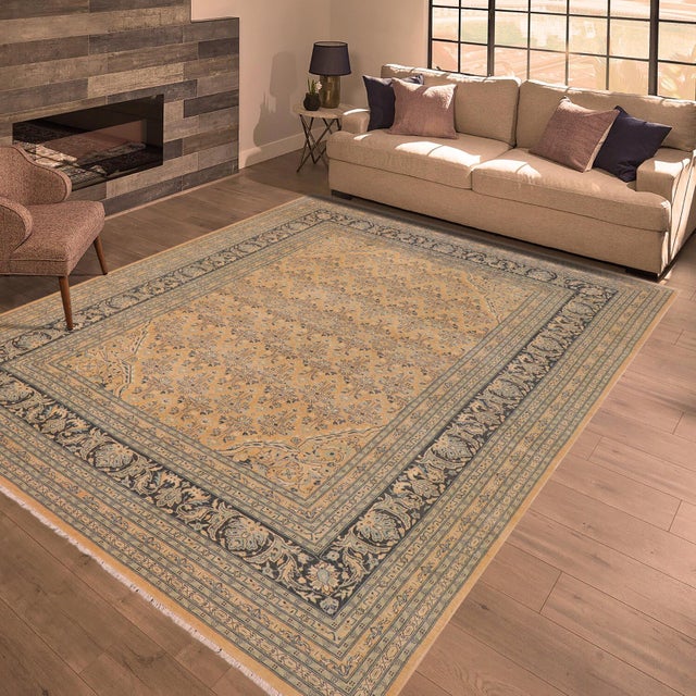Enhance the ambiance of your home with this magnificent Persian-influenced Turkish hand-knotted rug made by skilled...