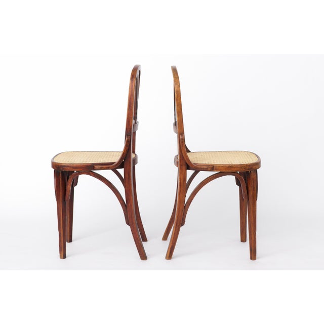 Pair of Bentwood Chairs, Austria, circa 1930s–1950s Price is for the set of two chairs. Both frames have been cleaned,...