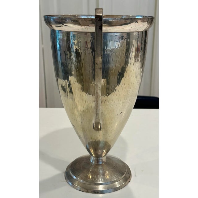 Shabby chic double handled urn shaped vase or trophy. Hammered sides. Makes a wonderful tall centerpiece vase.