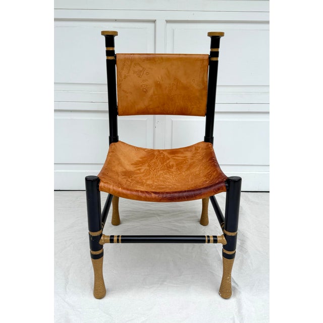 Here is an amazing Italian Modern chair designed/made in the Mid-Century. The chair is inspired by Thebes design with a...