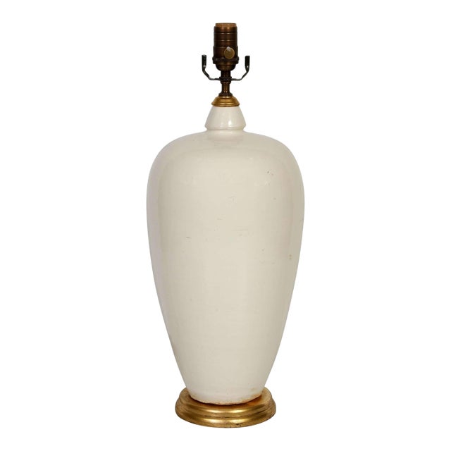 A Cream Color Ceramic Lamp on Giltwood Base With Linen Shade For Sale