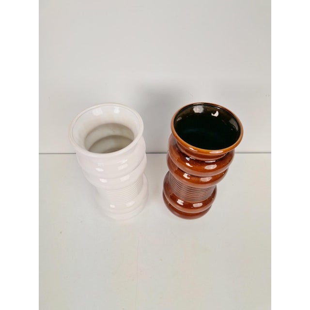 A pair 720/30 vase by alfred klein, west germany made of ceramic period: 1970 measurements: w 12 cm x d 12 cm x h 30 cm...
