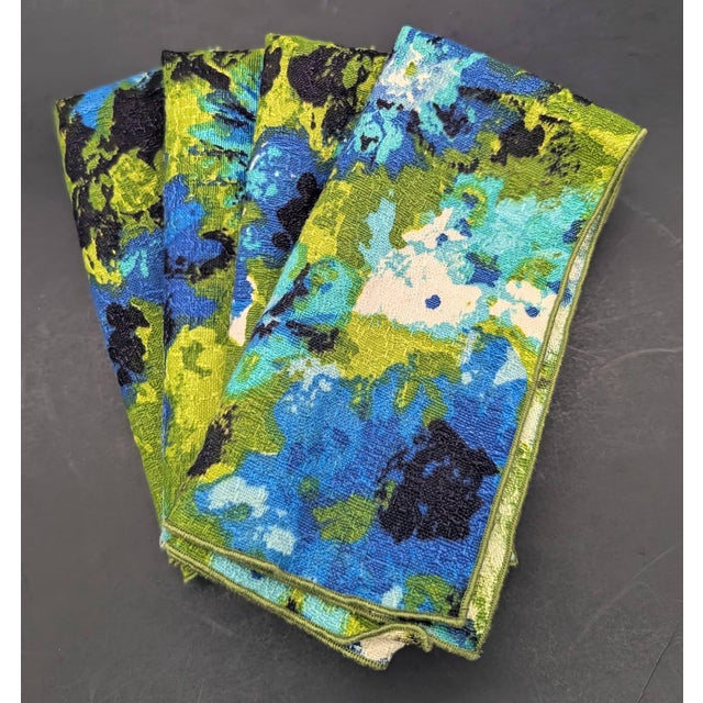Offered is a set of 4 vintage (circa. 1960s to 1970s) square floral cotton barkcloth napkins in shades of green and blue....