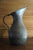 A beautiful old Persian tin washed copper pitcher with an elegant shape and classic floral design to the body. The perfect...