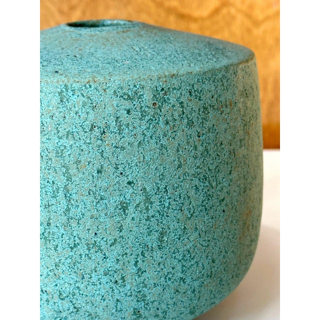 A stoneware vessel by British studio ceramist John Ward (1938-2023) circa 1985. The flat shouldered vase is molded in a...