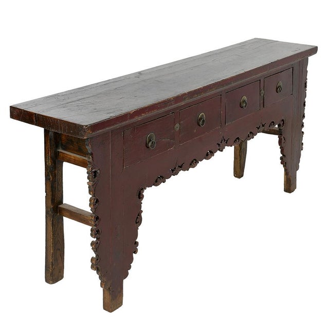 This Asian piece in red lacquered wood is an elegant and refined piece that brings a touch of authenticity and exoticism...