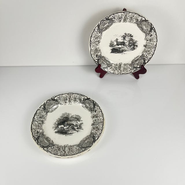 Set of three antique Sarreguemines U&C plates, hunting scene, circa 1850 - 19th century, black earthenware: The Doe,...