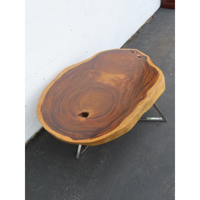 This gorgeous Coffee Table is made of solid wood and a chrome base. The Coffee Table has a gorgeous thick natural wood...