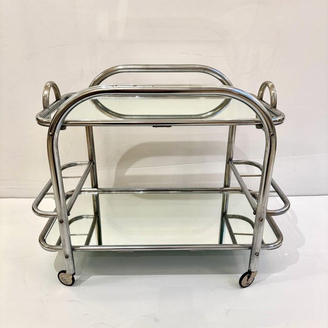 An Art Deco bar cart designed by renound French architect Robert Mallet-Stevens. (1886-1945). Stevens was the founder of...