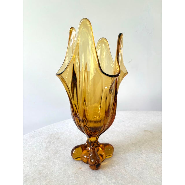 Lovely mid-century modern Amber color glass swung vase.