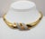1970s goldtone pavé clear rhinestone articulated collar necklace with fold over clasp. Signed crown "TRIFARI©." Measures:...
