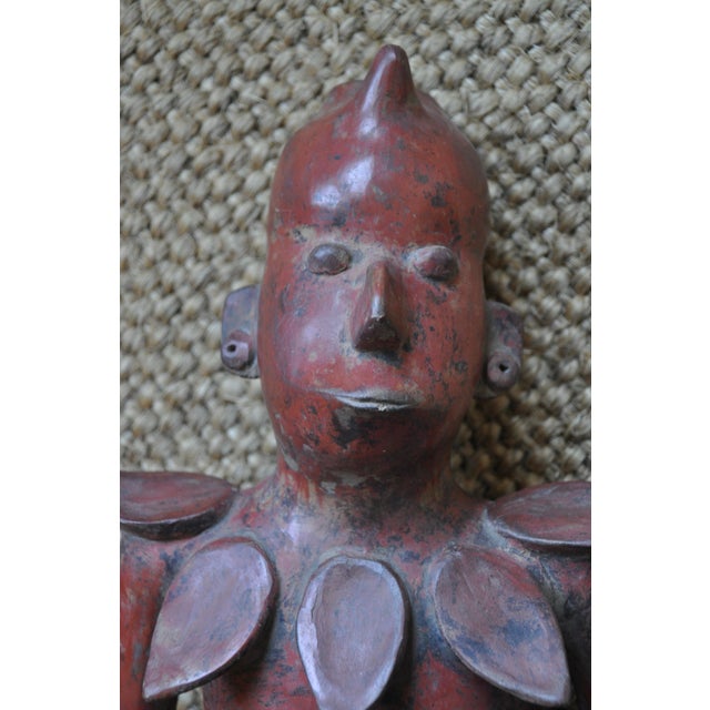 This highly decorative piece of Colima Style pottery measures 14" tall and 8" wide. It is vintage, but not ancient...