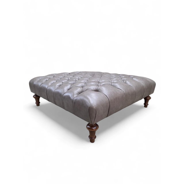 Vintage Chesterfield Style Tufted Gray Leather Ottoman on Turned Walnut Legs Vintage Chesterfield-style tufted ottoman...