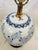 Vintage Blue & White Chinoiserie Table Lamp with shade. Has a wooden base, floral design throughout the lamp. Perfect for...