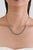 This modern tennis necklace features 3.85 carats of natural round emeralds, set in 18K white gold. Each emerald measures...