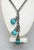 This is part of Chairish’s Costume Jewelry assortment. 1950s Modernist silvertone three melon shaped faux-turquoise glass...