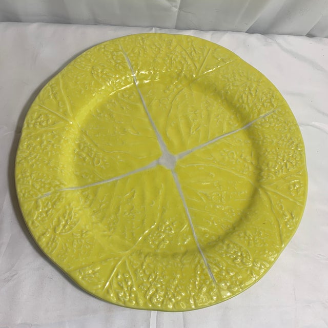 A vibrant and beautifully textured vintage mid-century modern majolica-style round serving platter (chop plate), produced...
