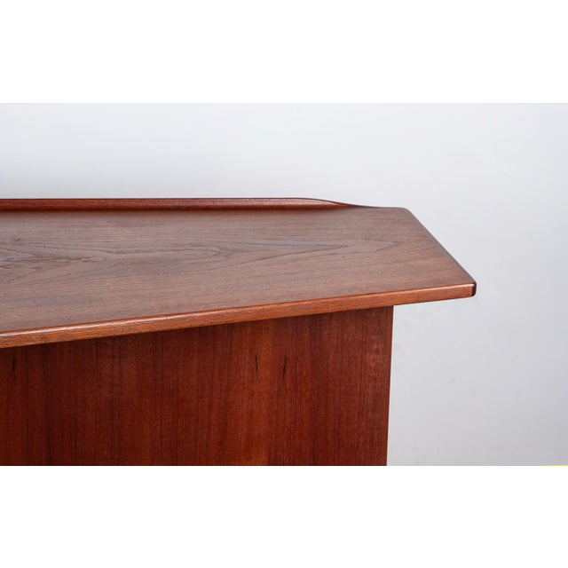 Danish Boomerang Desk in Teak and Brass by Peter Lovig Nielsen for Dansk Design, 1968, in Flawless conditions. Designed...