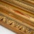Pair of large wall mirrors in a gold-patinated stucco frame with a strongly profiled moulding. A leaf frieze forms the...