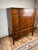 A beautiful interpretation of classic American Federal design, this vintage chest on stand was produced by the highly...