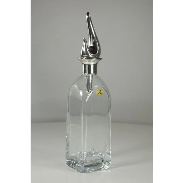 This crystal bottle with a cap and rim in 925 silver comes with the silversmith's original packaging. Imprinted by...