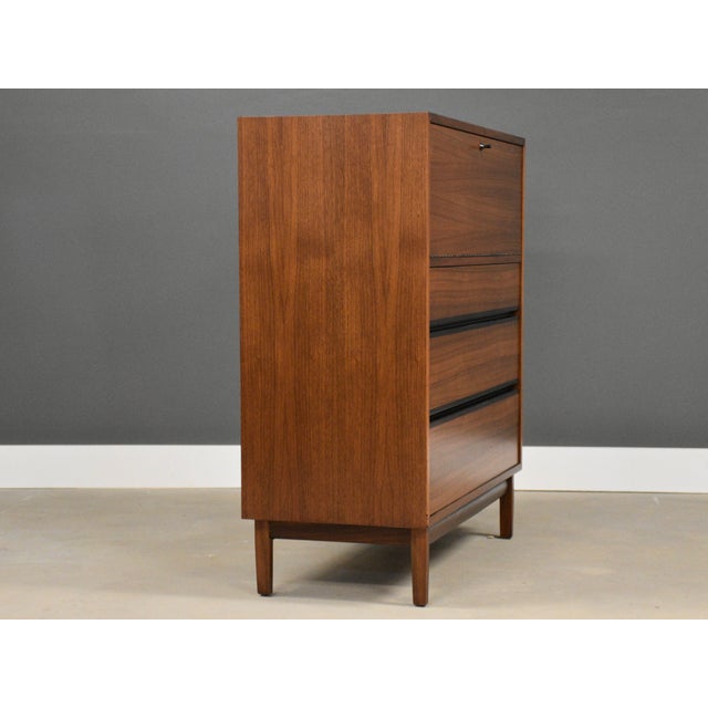 A mid century modern walnut tall dresser designed by Kipp Stewart for Directional by Calvin. Professionally restored in...