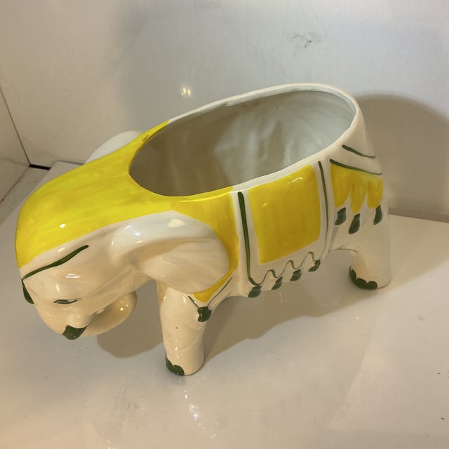Large porcelain elephant planter hand decorated in a bright retro Hollywood Regency yellow and green design against a...