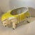 Large porcelain elephant planter hand decorated in a bright retro Hollywood Regency yellow and green design against a...