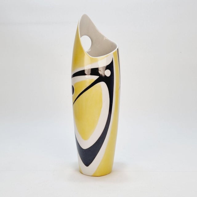 Zsolnay porcelain vase from the 1960s. Designed by János Török, this yellow and black composition is a striking home decor...