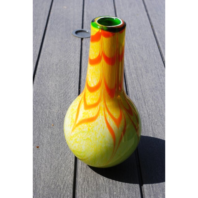 This beautiful art glass vase was inspired by mid century colors; orange, yellow and green. It has a popular mid century...