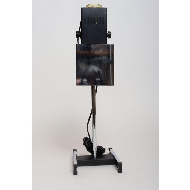 Vintage Robert Sonneman chrome stage or spotlight-style task/table lamp with faux-wood laminate double 'T' base (ca....