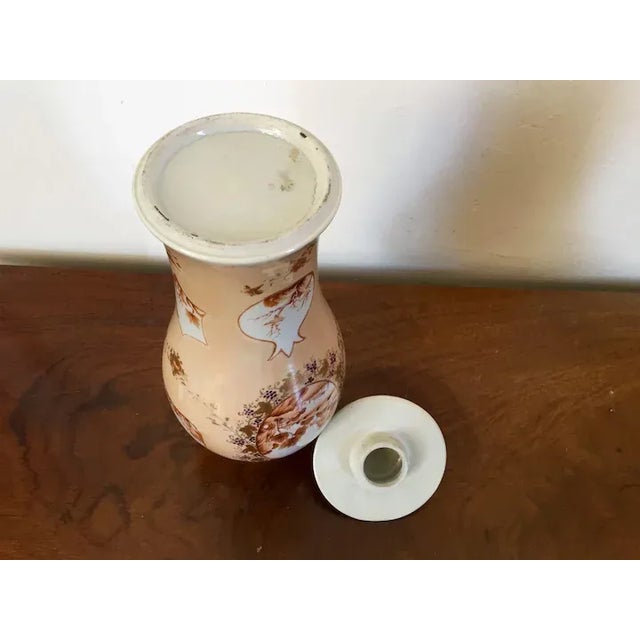 Antique early 19th c. Chinese export porcelain baluster shaped vase & cover. Decorated on all sides with sepia reserves...