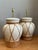 This elegant pair of vintage ceramic and rattan table lamps beautifully captures the relaxed sophistication of mid-century...