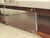 Stunning and substantial vintage modernist two-tiered coffee table. The rosewood veneer features a truly one-of-a-kind...