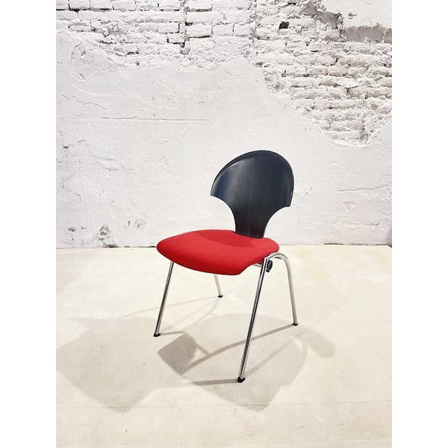 This distinctive vintage chair was designed and manufactured by Kusch+Co in the 1980s and represents the bold postmodern...