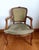 Louis XV style cabriolet armchair upholstered in sage green velvet with a floral design on the upper part of the back....