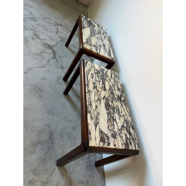 Elegant pair of vintage French side tables circa 1960s, featuring clean, minimalist lines that reflect classic mid-century...