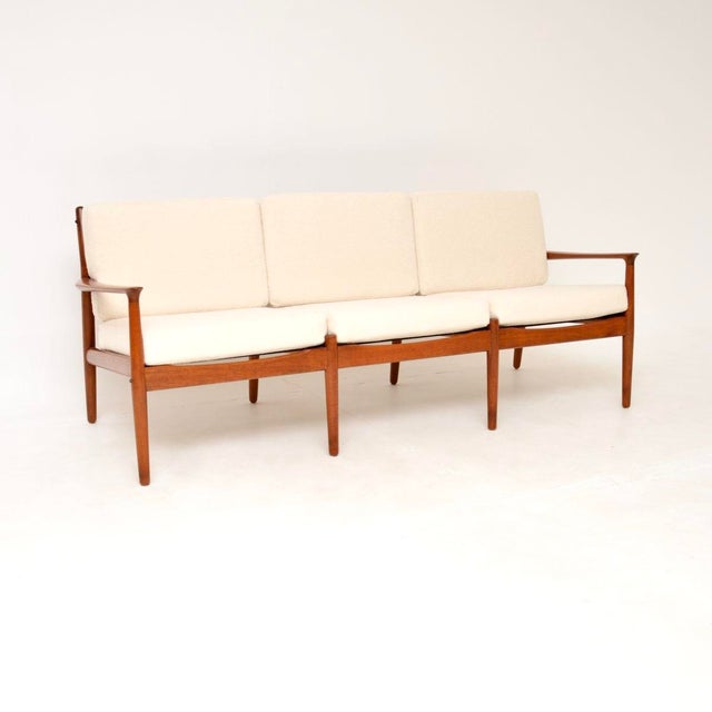 A beautiful and extremely well made Danish teak vintage sofa by Svend Age Eriksen. This was made in Denmark by Glostrup,...