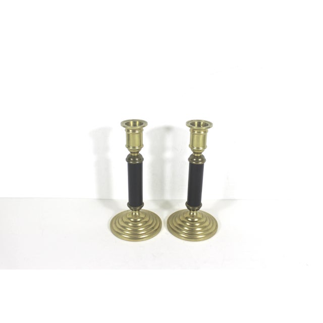 Width: 2.75 inches Height: 6 inches Depth: 2.75 inches Pair of vintage brass and black candle holders. Please take a close...