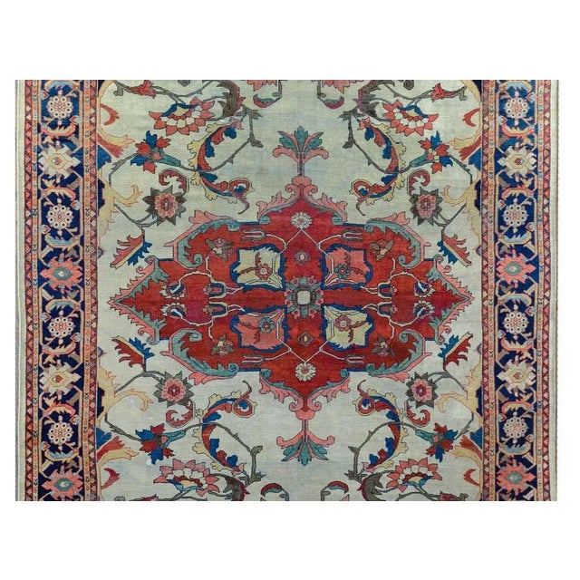An incredible late 19th century Persian Sultanabad with the best large-scale crimson medallion with stylized flowers and...