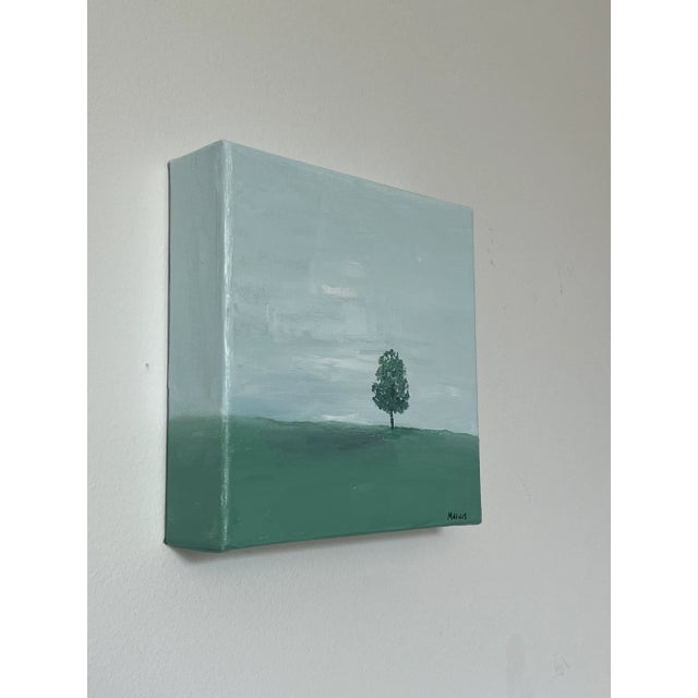 A single tree in a serene setting can symbolize solitude and contemplation. It's a place where one can seek solitude and...