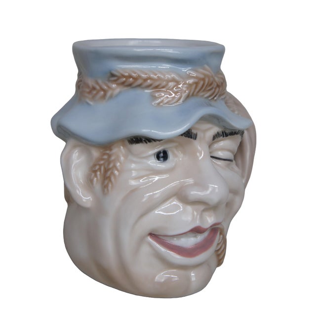 Vintage Royal Doulton 6780 porcelain character jug pitcher of John Barleycorn, The design features a winking man wearing a...