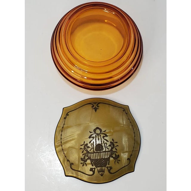 Pattern: Floral And Ribbon Motif On Lid Color: Amber Date Produced: 1930s Shape: Powder Jar With Lid