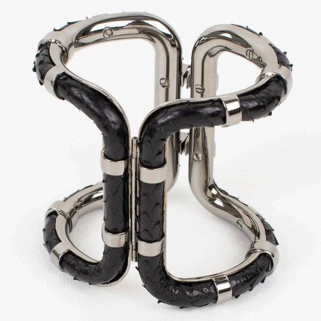A sophisticated Lanvin Paris modernist clamper bracelet. This statement piece features an oversized gray steel framing in...