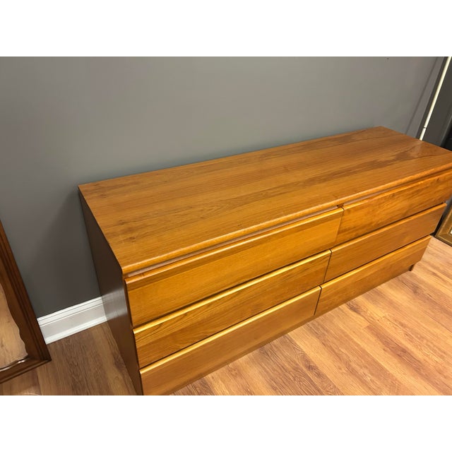 Bring classic Scandinavian design into your home with this beautiful vintage teak 6-drawer dresser. Featuring a...