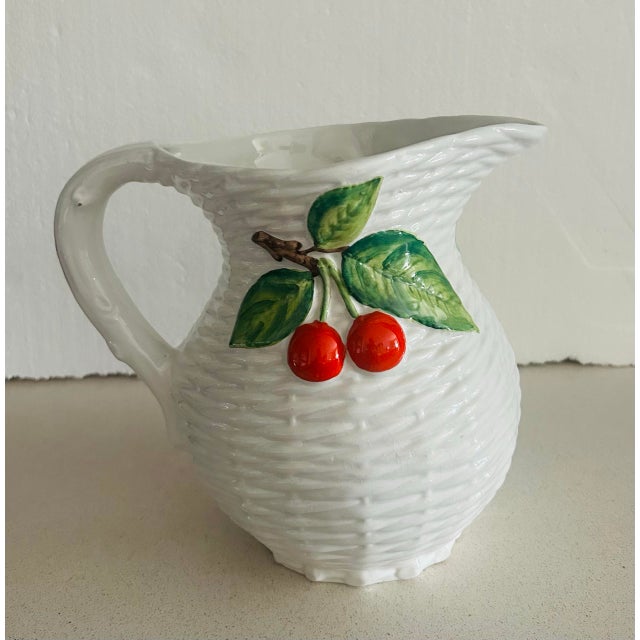 Bring the warmth of the Italian countryside into your home with this beautiful hand painted majolica pitcher. This richly...